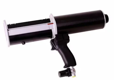 Pneumatic caulking gun with black barrel and light pink handle for dispensing sealants