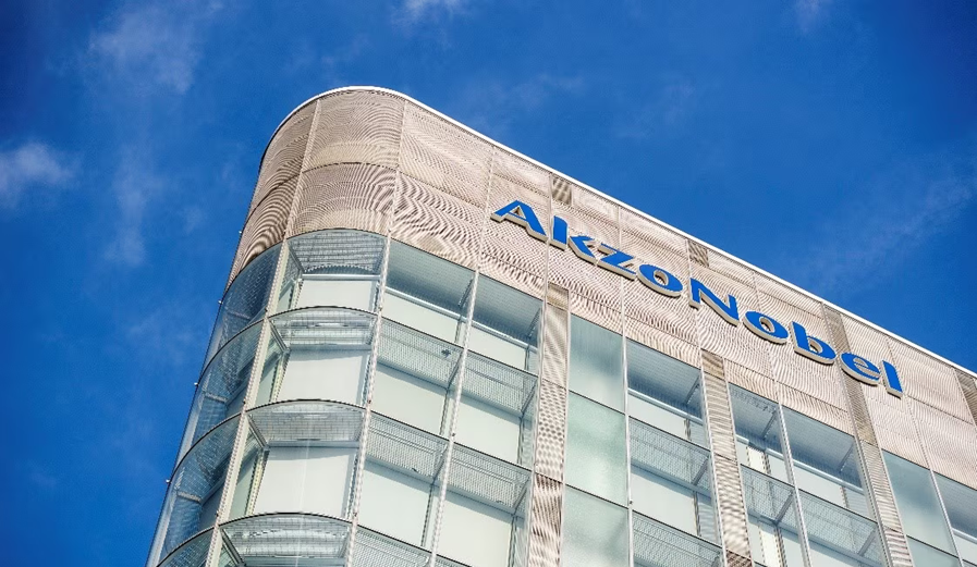 AkzoNobel corporate headquarters with blue logo on modern glass and metal facade
