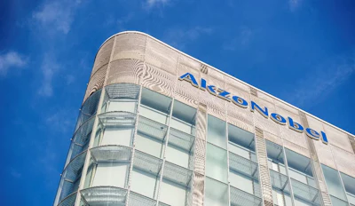 AkzoNobel corporate headquarters with blue logo on modern glass and metal facade