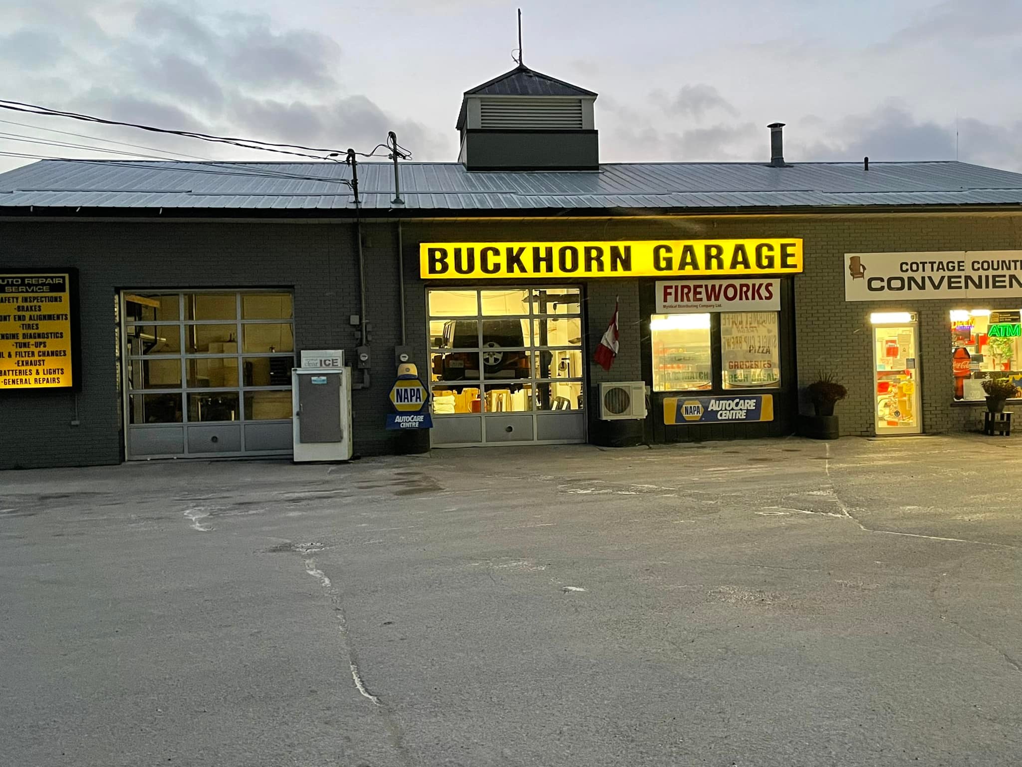 Rural garage and convenience store with fireworks sign on cloudy day