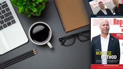 Workspace with laptop, coffee, notebook, glasses and Golf Repair Magazine