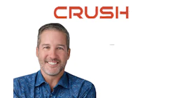 Crush logo with smiling professional in blue patterned shirt