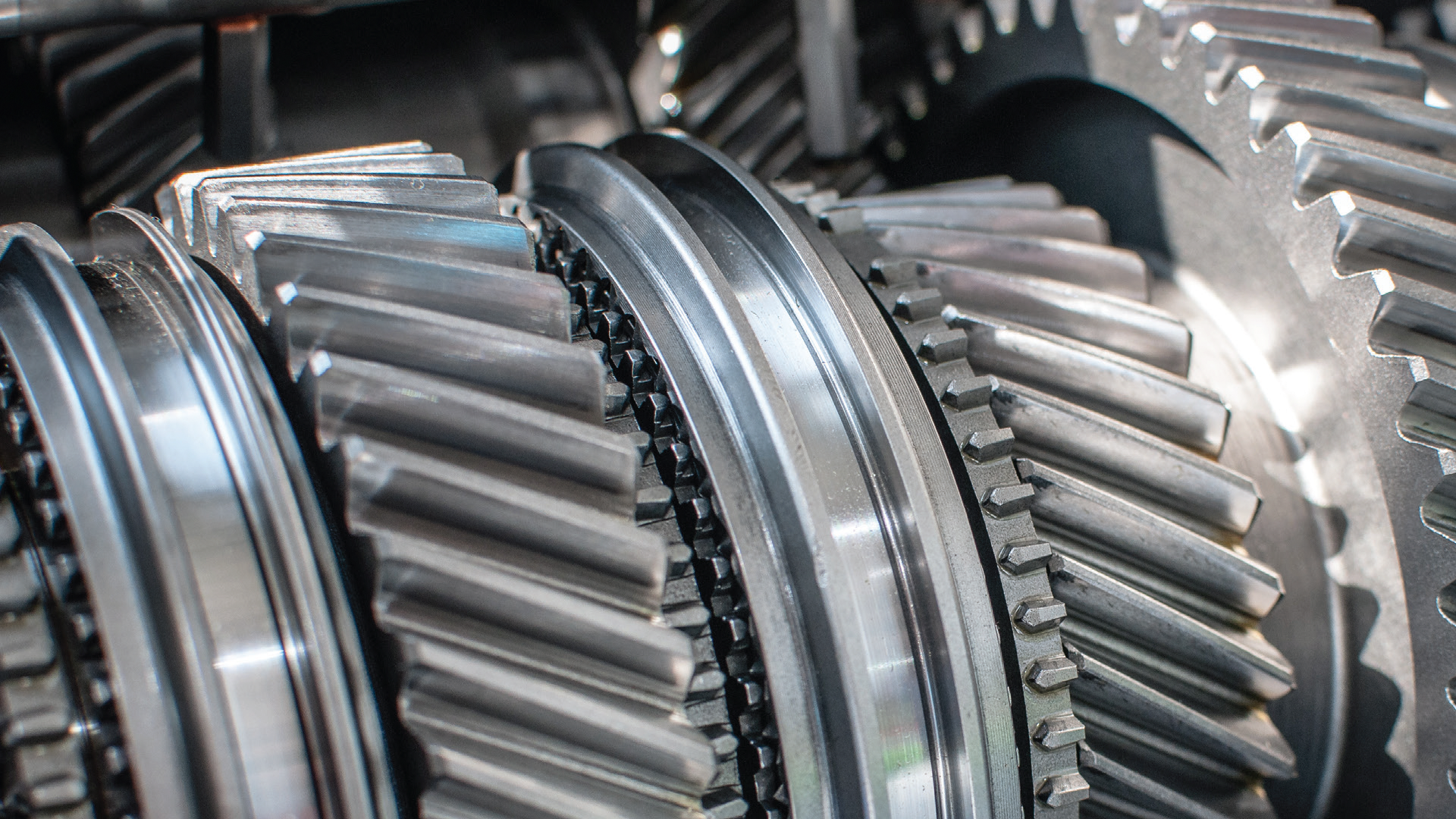 Close-up of interlocking metal gears in industrial machinery transmission system