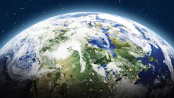 Earth from space, showing blue oceans, green landmasses, and white cloud formations