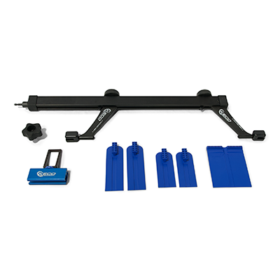 Suspension or frame adjustment kit with black bar, blue protective covers, and assembly components