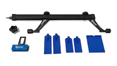 Suspension or frame adjustment kit with black bar, blue protective covers, and assembly components