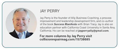 Professional headshot of Jay Perry, business coach and author, smiling in business attire