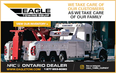 White and red heavy-duty tow trucks for Eagle Towing Equipment in industrial setting