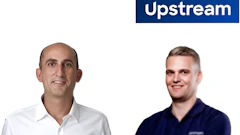 Two professional men smiling at camera with Upstream company branding