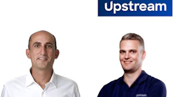 Two professional men smiling at camera with Upstream company branding