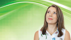 Professional woman in floral sleeveless top looking upward on green background