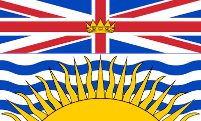 British Columbia provincial flag featuring Union Jack design with rising sun symbol in gold and blue