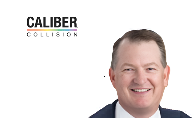 Caliber Collision executive headshot - professional man in navy jacket smiling