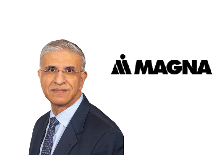 Professional headshot of male executive with Magna International logo