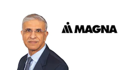 Professional headshot of male executive with Magna International logo