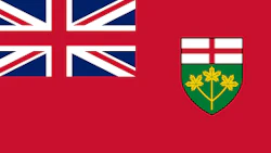 Ontario provincial flag featuring Union Jack and green shield coat of arms with cross and floral emblems