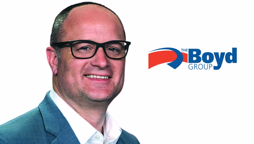 Professional headshot of male executive in blue blazer with The Boyd Group logo