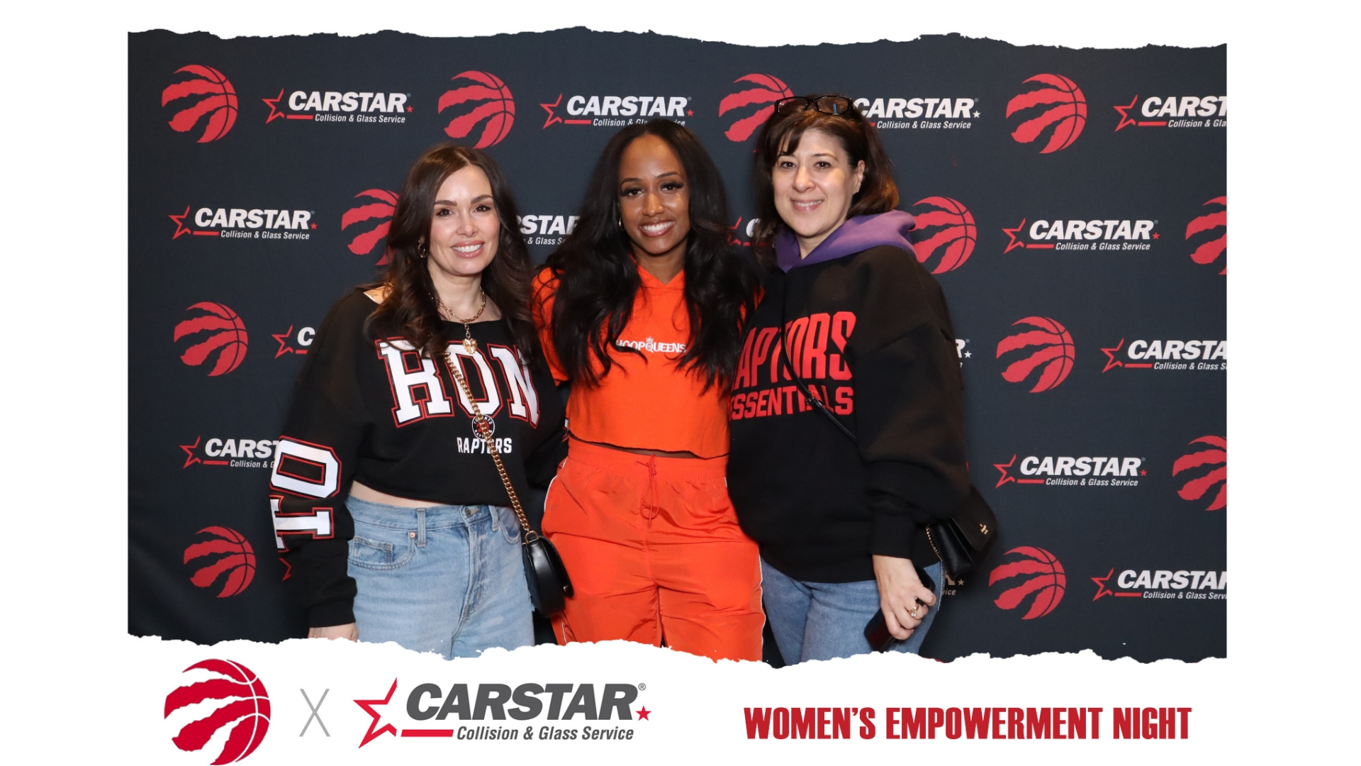 Three women pose together at a Toronto Raptors Women's Empowerment Night event sponsored by CARSTAR, wearing team apparel against branded backdrop.