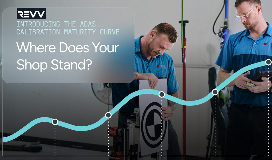 Two technicians in blue uniforms examine automotive wheel alignment equipment with REVV ADA calibration maturity curve promotional messaging