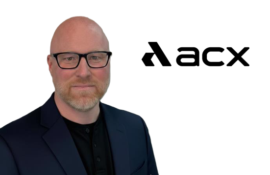 Professional headshot of man with glasses wearing navy blazer next to ACXL logo