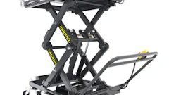 Black mobile scissor lift table with yellow accents, extended platform, and caster wheels for industrial material handling