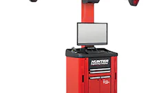 Red and black Hunter wheel alignment machine with monitor, measurement arms, and rolling cabinet base