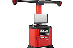 Red and black Hunter wheel alignment machine with monitor, measurement arms, and rolling cabinet base