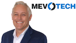 Professional headshot of smiling man in navy blazer with MEVOTECH logo