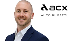 Professional headshot of male executive in navy blazer with acx Auto Bugatti branding