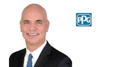 Professional headshot of smiling businessman in dark suit with blue tie, alongside PPG Industries logo