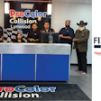 ProColor Collision Lynwood team members standing at reception desk with branded signage and FIX Network partner logos displayed