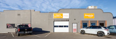 TED'S Auto Body and Simplicity business storefront with vehicles parked outside