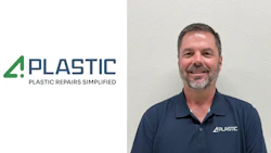 Professional male employee in navy 4PLASTIC polo shirt smiling at camera against white background