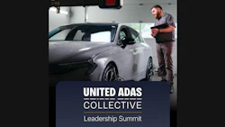 Technician inspecting white vehicle in garage with United ADAS Collective Leadership Summit branding