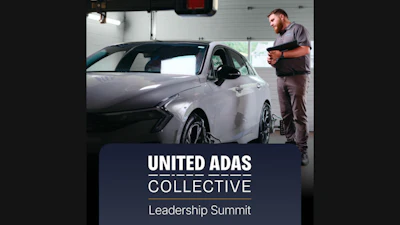 Technician inspecting white vehicle in garage with United ADAS Collective Leadership Summit branding