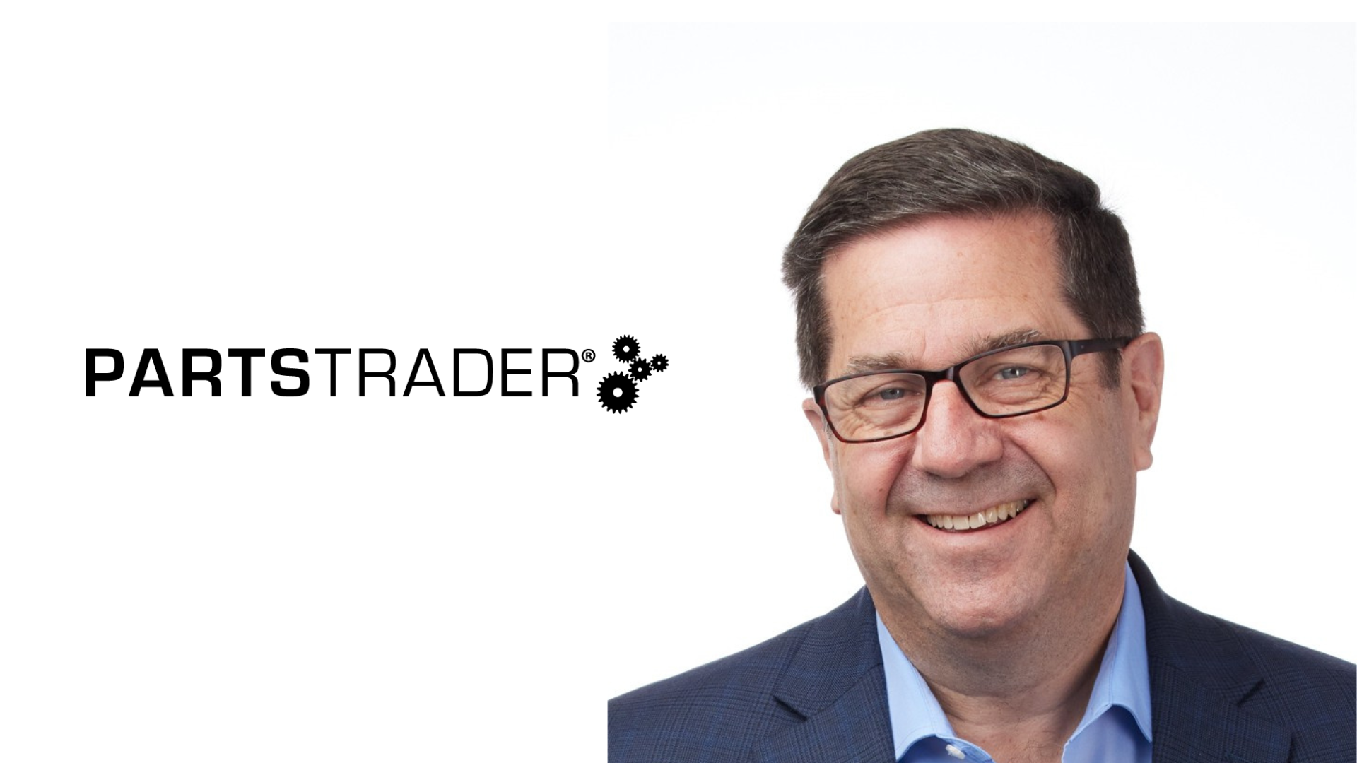 PartsTrader executive or team member professional headshot wearing glasses and blue business shirt