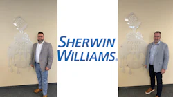Two professional men in business casual attire standing before Sherwin-Williams branded backdrop with paint can logo