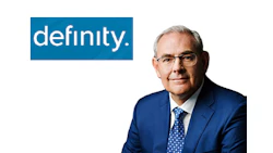 Definity company logo with professional headshot of male executive in blue suit and glasses