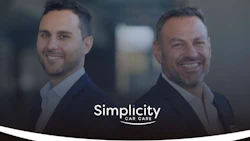 Two professional men in business attire smiling at camera with Simplicity Car Care logo overlay