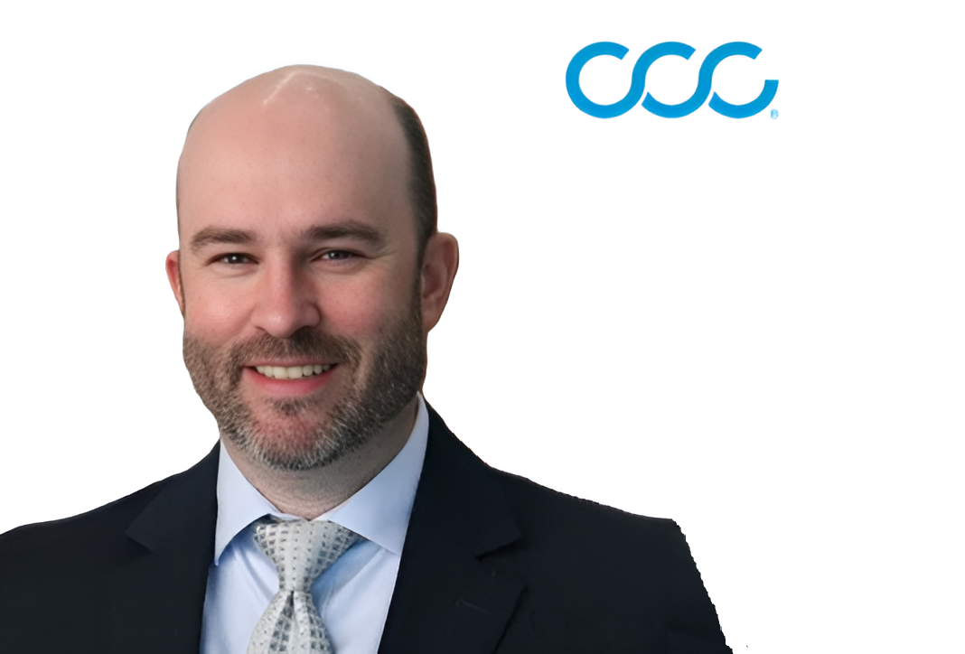 Professional headshot of bearded man in dark suit with light blue tie next to CCC company logo