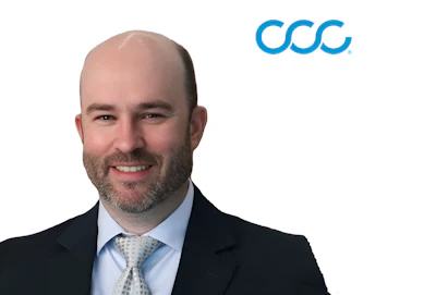 Professional headshot of bearded man in dark suit with light blue tie next to CCC company logo
