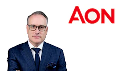 Professional man in navy suit with glasses and AON logo branding