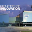 CWB Centre of Innovation modern facility at twilight with illuminated signage and landscaping