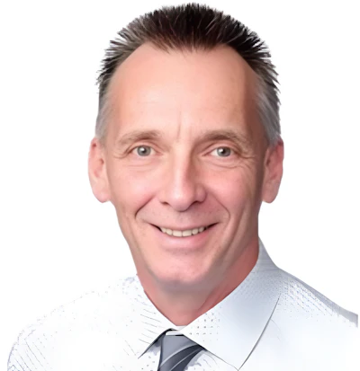 Professional headshot of smiling man in light blue shirt and dark striped tie