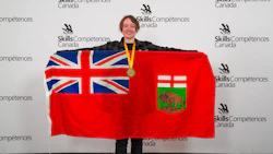 Young woman holding Ontario flag and wearing gold medal at Skills/Compétences Canada competition event