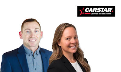 Two professional employees smiling at camera with CARSTAR Collision & Glass Service logo