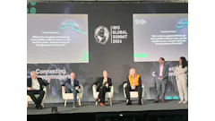 IBIS Global Summit 2024 panel discussion with five speakers seated on stage discussing changemakers in collision repair industry