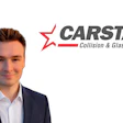 Professional headshot of male business executive with CARSTAR Collision & Glass Service branding