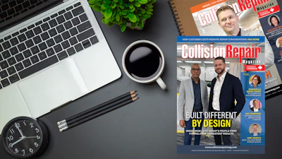 Collision Repair Magazine cover displayed on desk with laptop, coffee, and office supplies