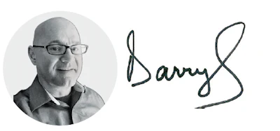 Professional headshot of bald man wearing glasses and dark jacket alongside handwritten signature reading Barry S